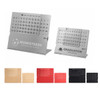 A silver aluminium desk calendar features monthly grids, with options in black, red, gold, and rose gold. Includes a logo.