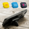 A universal magnetic car mount with three coloured magnets in yellow, blue, and black, displayed with a smartphone on a wooden surface.