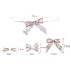 A set of decorative bows in white and gold, featuring various sizes and a ribbon tie for fastening.