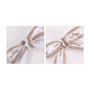A set of two twist tie bows featuring a white and brown checkered design with branding.