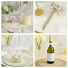 A collection of decorative Twist Tie Bows in white and pastel colours, tied around various table items and a drink bottle.