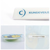 A custom acrylic name badge featuring a bee design with a pin backing, predominantly white and yellow.