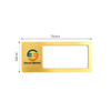A reusable metal name badge in gold with a clear window and a logo. Dimensions are 76mm by 38mm.