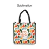 A vibrant tote bag featuring an abstract pattern in green, orange, and blue, with black handles and a logo.