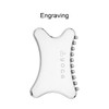 A transparent Gua Sha tool with a smooth surface and small beads on one edge, featuring a logo.