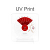 Acrylic desk calendar with a red and white design, featuring dates and decorative elements for the year 2026.