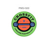 A green frisbee with a circular design featuring an orange barbell, stars, and the word "CrossFit".