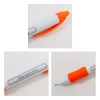 A white pen with an orange clip and grip, featuring a transparent panel with a motivational message.