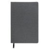 A grey notebook with a textured cover and a black ribbon bookmark, featuring a logo on the front.