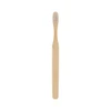 A large flat handle toothbrush with a bamboo handle and white bristles, featuring a textured grip and no visible branding.