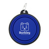 A blue collapsible pet bowl with a black rim and a logo featuring a cartoon dog face, attached to a metal carabiner.