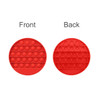 A red circular fidget toy featuring push-pop bubbles on both the front and back sides.