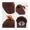 A brown baseball cap featuring a plush decoration on the back and a Velcro patch.