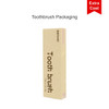 A foldable toothbrush in yellow packaging with a logo, featuring a simple design and modern look.
