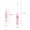 A pink transparent foldable handle toothbrush with a protective case. It features a logo and measurements indicated.