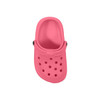A pink classic clog shoe charm with ventilation holes and a black button detail. It has a simple, smooth design.