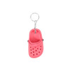 A pink classic clog shoe keyring with a metal keychain attachment. Features ventilation holes and a sleek design.