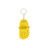 A yellow clog shoe keyring featuring ventilation holes and a metal chain attachment.