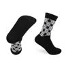 Crew custom pattern woven bamboo socks in black and grey with a towel bottom for added comfort. Features a logo.