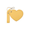 A heart-shaped compact mirror in yellow with a keychain attachment and a strap.