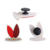Custom shoe charms in red and white, featuring various playful designs and one with a black button.