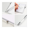 A silver aluminium pocket notebook with a pen, featuring a smooth cover and refillable notepad inside.
