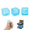 A blue stress relief cube with snowflake designs, accompanied by a hand squeezing it and its retail box.