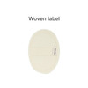 A natural cotton linen bath sponge pad in a cream colour with a woven label attached.