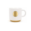 A ceramic coffee mug in white with ribbed texture and a bronze medal accent at the front.