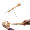 A detachable shower brush with a long wooden handle and a handle strap, displaying a natural wood finish.