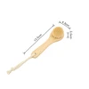A natural wooden face brush with a soft bristle head and a rope handle, measuring 13.5 cm in length.