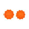An orange Popper Ball with a textured surface and a small handle, featuring a simple design. It has branding on one side.