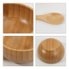 A bamboo facial mask bowl set featuring a round bowl and a matching spoon, both in natural bamboo colour.