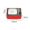 A retro TV-style gift box in red, measuring 10cm by 7cm by 4cm, featuring a logo on the design.