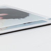 A clear acrylic fridge magnet featuring a photo insert, with a black backing for stability.