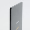 A sleek black acrylic menu stand with a smooth edge and glossy finish, featuring a branding logo.