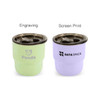 A double wall stainless steel camping mug in light green and lavender, each with a lid and different branding.