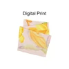A twill weave square scarf featuring a pastel pink background with a vibrant floral digital print in yellow and orange hues.