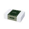 A white hamper box with a green decorative band featuring intricate patterns and a gift message.