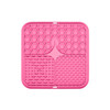 A pink, three-section dog enrichment lick mat featuring various textured patterns for interactive play.