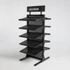 A black hat rack with multiple shelves and a branding logo at the top.