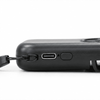 A black mini pocket fan with a USB-C charging port and a strap attachment for easy carrying.