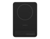A black slim power bank with a circular charging surface and a branding logo on it.