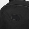 A black backpack with a textured surface and a small, blank rectangular area. It features a logo or branding.