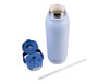 A drink bottle in light blue with a dual spout lid, ceramic lining, and a removable straw. It features branding on the body.