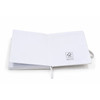 A white FSC notebook with blank pages and a logo on the inside cover, featuring a ribbon bookmark.