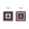 A tapestry blanket featuring a green Christmas tree design on a plaid background, with a coordinating plaid back.