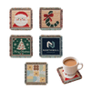 A collection of Jacquard coasters featuring festive designs, including Santa, a Christmas tree, and floral patterns in various colours.