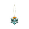 A star-shaped ceramic ornament featuring a mountain landscape design in teal, orange, and green, with a hanging ribbon.