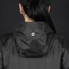 A black windbreaker jacket featuring a hood and a logo on the back.